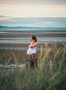 Pregnant woman on the beach,
