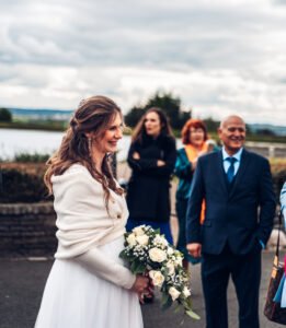 Bride holding flowers.