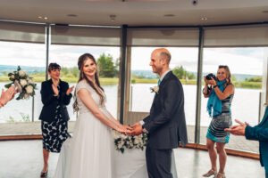 Bride and groom laughing at the ceremony.