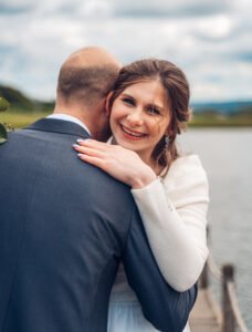 Bride smiles directly at the camera.